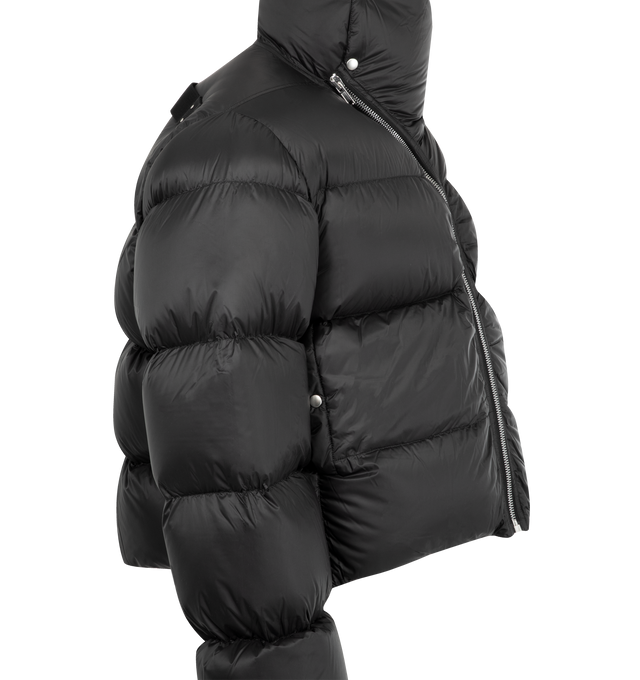Image 3 of 3 - BLACK - Rick OwensTurtle duvet jacket crafted from black lightweight nylon. Padded and quilted jacket cropped below the waist featuring a center front zipper, high tube neck collar with bias zipper and snaps, side-front welt pockets and a signature cotton webbing strap with rivet detail at the back yoke. 100% nylon (recycled) with 100% new wool knit rib cuffs, cotton/elastane pocket lining and goose down/mallard feather padding.