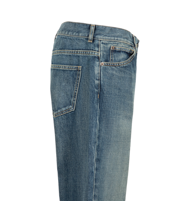 Image 3 of 3 - BLUE - The Row Women's Dinni Jeans are crafted from Japanese cotton denim and feature a mid-rise waist, a relaxed straight-leg silhouette, and a vintage-inspired wash designed to evolve with wear over time. Cut to a full length that lightly grazes the heel, this everyday style combines classic proportions with the brand's understated approach to denim. Main Material: 100% Cotton.
