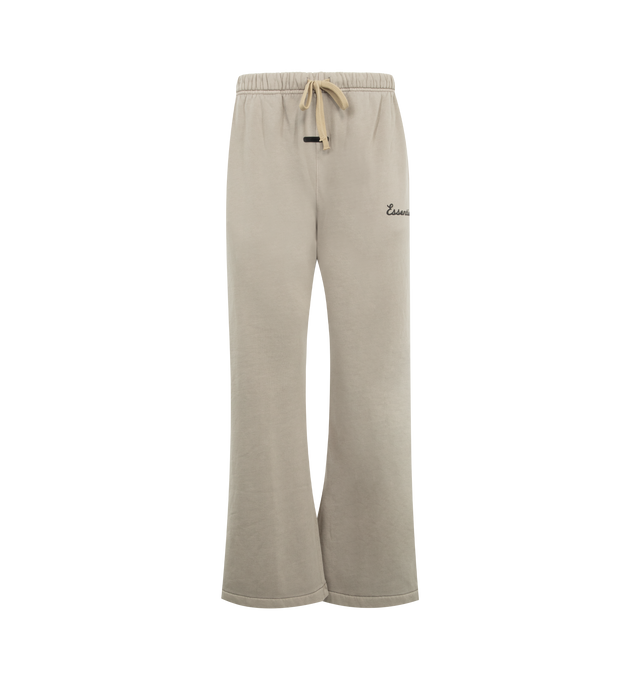 Image 1 of 3 - NEUTRAL - FEAR OF GOD ESSENTIALS Training Classic Flare Sweatpant featuring 390GSM core fleece, relaxed silhouette extends into a flared leg, encased elastic waistband with elongated drawcords, side seam pockets, puff-printed Essentials training logo on the leg and an Essentials signature label at the center front. 80% cotton, 20% polyester.