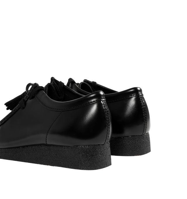 Image 3 of 4 - BLACK - CLARKS Wallabee Hi Shine Leather Shoe featuring dress leather uppers, lace tassels, three FOBS Clarks Originals, kiltie FOB and 200 years FOB, removable tonal kiltie, natural pebble crepe with a black sole spray, Clarks Originals heat embossed logo on sock, moccasin construction and hand stitched apron seam.