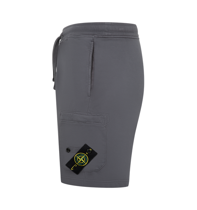 Image 3 of 3 - GREY - STONE ISLAND Shorts featuring standing hand pockets, one pocket on back with fixed flap and hidden snap, patch pocket on left leg with hidden zipper and Stone Island badge, elasticated waistband with drawstring, zipper fly, overlock seams and regular fit. 100% cotton.