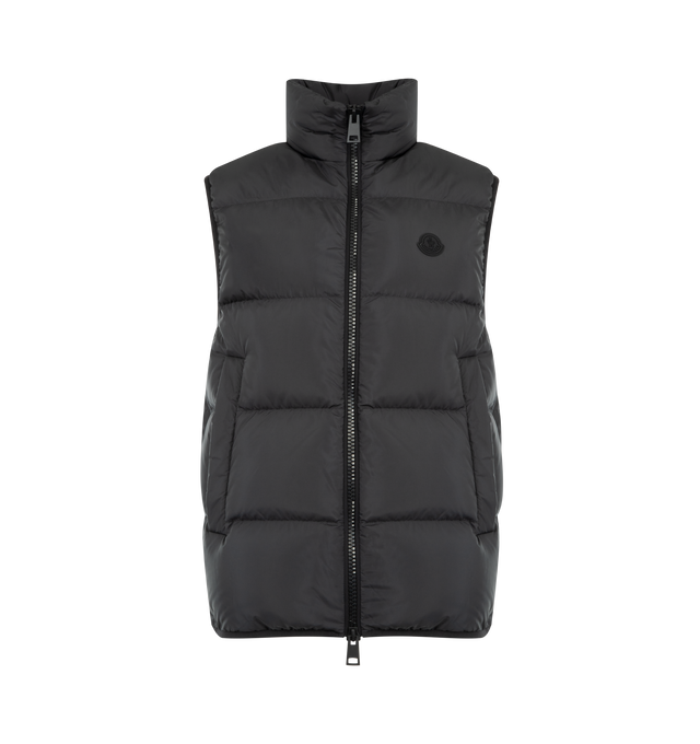Image 1 of 3 - BLACK - MONCLER Gabas Down Vest featuring micro soft lining, down-filled, stand collar, zipper closure, side pockets with snap button closure, zipped inner pockets, elastic cuffs and hem and silicone logo patch. 100% polyester. Padding: 90% down, 10% feather. Made in Romania.