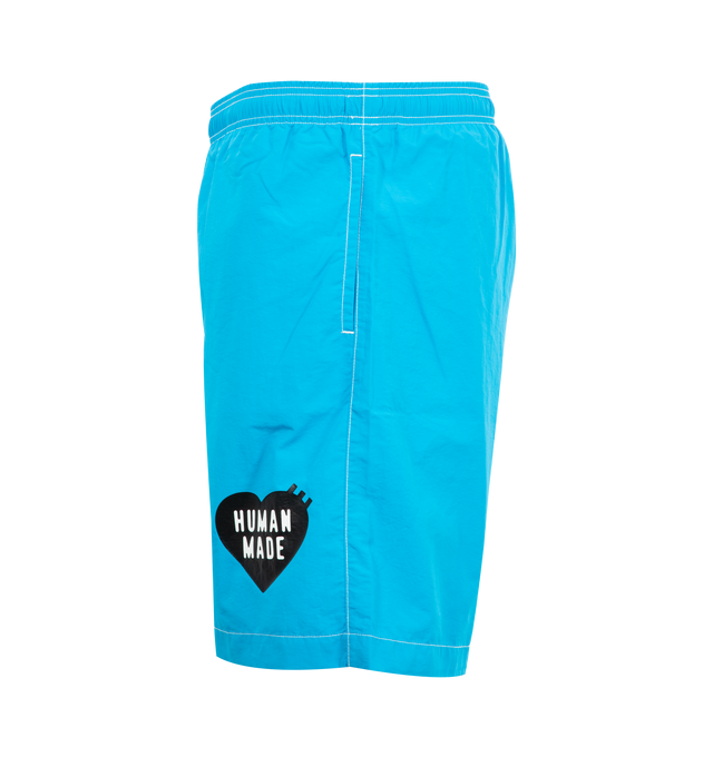 Image 3 of 3 - BLUE - HUMAN MADE Swim Shorts featuring contrast stitching, logo printed at front leg, side pockets, back welt pocket and elastic waist.