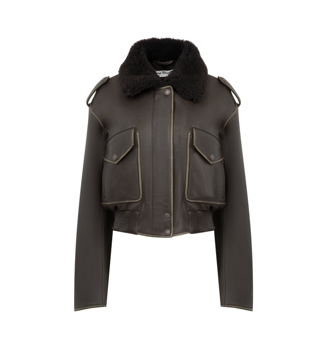 Image 1 of 3 - BROWN - ACNE STUDIOS Leather Bomber Jacket featuring soft lamb leather with a shearling collar, dropped shoulders with epaulettes, front flap pockets, side welt pockets, an elasticated hem, front snap button, zipper closure, zip sleeves, a metal logo plaque at the back neckline, relaxed fit and below-waist length. 100% Lamb leather. 100% Lamb shearling. Lining: 100% viscose.