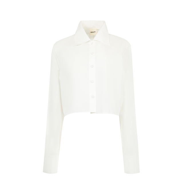 Image 1 of 2 - WHITE - KHAITE Jasen Top featuring a button-up designed for a more straight and open fit with shrunken cuffs, covered buttons at the placket and single-button cuffs. 100% cotton.