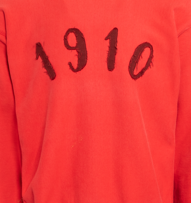Image 3 of 4 - RED - Cherry red authentic vintage sweatshirt with paint smudge at the shoulder,  "1910" applique at the front and Transnomadica label at the back on a Champion reverse weave sweatshirt with logo embroidered at the wrist.  Measurements: 25 inches in length from neckline to front hem, 24 inches from shoulder-to-shoulder, 24 inches from armpit-to-armpit, 23 inches from top sleeve seam to top of wrist.This collection of vintage sweatshirts, exclusively for 1910 at Hirshleifers, each featuring  