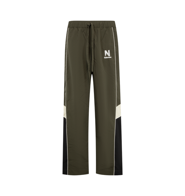 Image 1 of 4 - GREEN - Nahmias Men's Warm Up Pants are crafted from premium performance fabric and feature a relaxed silhouette with an elasticated drawstring waistband, side pockets, and elasticated cuffs for a comfortable athletic-inspired fit. These designer track pants combine everyday functionality with Nahmias' signature luxury streetwear aesthetic, creating a versatile essential for casual wear and coordinated styling. Main Material: Premium Nylon Performance Fabric.
