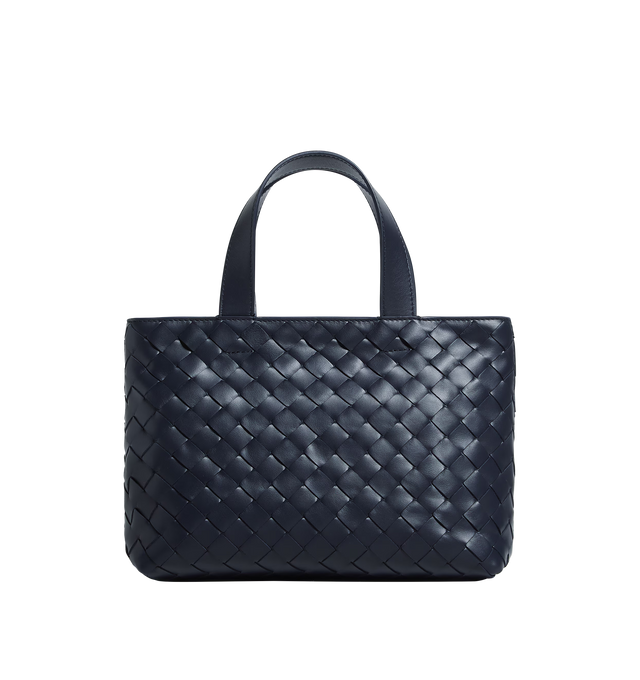 Image 1 of 3 - NAVY - BOTTEGA VENETA Mini Intrecciato Zipped Tote featuring mini Intrecciato leather zipped tote bag with adjustable and detachable cross-body strap, one external hidden pocket with magnetic closure, one interior zipped pocket and two flat open pockets and zipper closure. Calfskin. Lining: canvas. 7.1" x 10.6" x 3.9". Made in Italy.