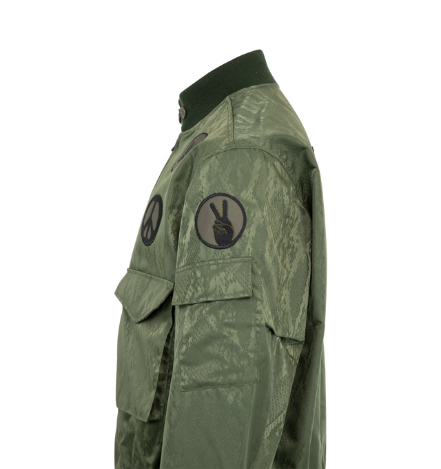Image 3 of 3 - GREEN - NEEDLES G-8 Jacket featuring front zip closure, 2-pocket styling, embroidered iron-on badges, elastic waistband and midweight ripstop fabric. 100% cotton. Made in Japan.