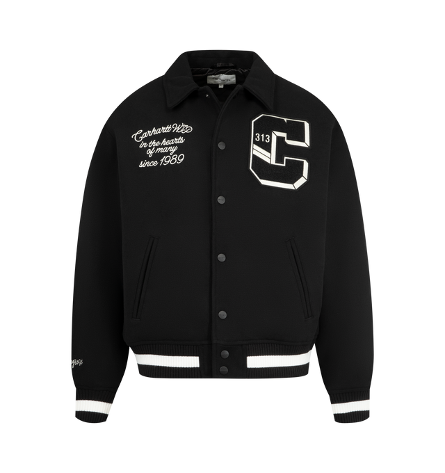 Image 1 of 4 - BLACK - CARHARTT World Class Varsity Jacket featuring nylon diamond quilted lined, rib-knit cuffs and bottom band, two front piped pockets, graphic embroidery and patches, inside chest pocket and front closure with personalized snaps. 70% polyester, 30% wool.