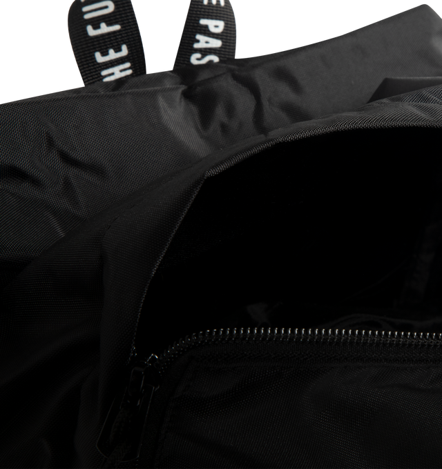 Image 3 of 3 - BLACK - HUMAN MADE Daypack featuring lightweight nylon Oxford exterior, PVC heart logo on the front, two-way zip closure, logo printed on top handle, front zip pocket, shoulder strap features a leather brand logo panel and one interior laptop sleeve. Capacity: around 20 L. 39cm x 34cm x 17cm.