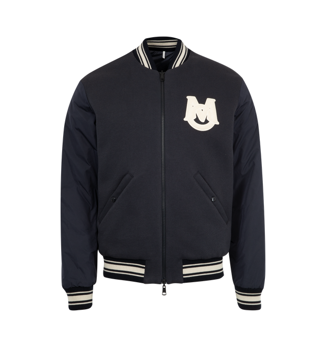 Image 1 of 4 - NAVY - MONCLER Vennes Reversible Down Bomber Jacket featuring cotton fleece, longue saison lining, reversible, micro soft back and arms, zipper closure, pockets with snap button closure, cuffs and hem with striped rib knit trim and terry cloth monogram patch.