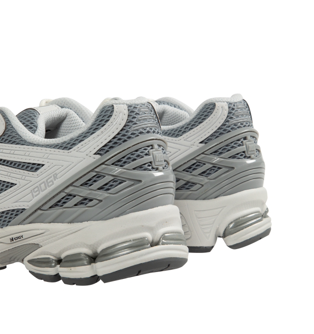 Image 3 of 5 - GREY - NEW BALANCE 1906R Sneaker featuring ACTEVA LITE midsole cushioning, ABZORB SBS heel cushioning, N-ergy outsole provides superior shock absorption, Stability Web outsole technology provides added arch support, TPU heel cage and rubber outsole. Mesh upper with synthetic overlays.