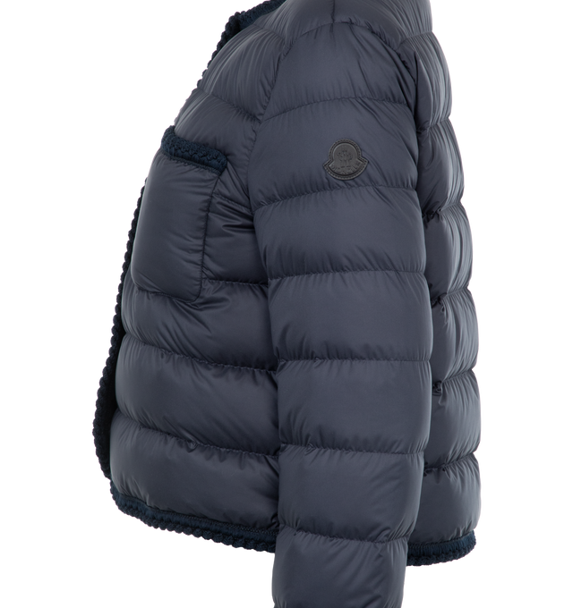 Image 3 of 3 - NAVY - Moncler Gencay Down Jacket has a jewel neck, a front snap closure, chest patch pockets, braided trim, and channel quilting. Lined. 90% down, 10% feather fill. 100% polyester exterior. Made in Romania.