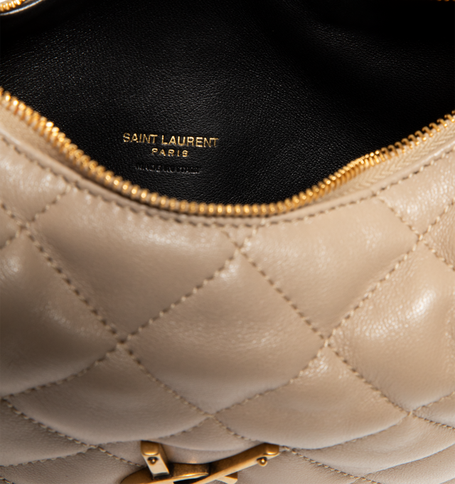 Image 3 of 3 - CHAMPAGNE - SAINT LAURENT Icarino Bag in quilted nappa featuring baby version of the iconic Icar, with diamond-quilted topstitching, leather lining, bronze-tone hardware and zip closure. 6.7-10.2" x 5.1" x 1.2". Lambskin. Made in Italy.