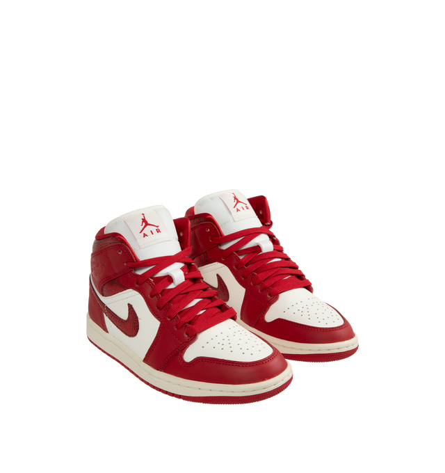 Image 2 of 5 - RED - JORDAN Air Jordan 1 Mid SE Sneaker featuring genuine leather in the upper, Nike Air technology, soft foam in the midsole, rubber in the outsole, wings logo on collar and Jumpman on tongue.