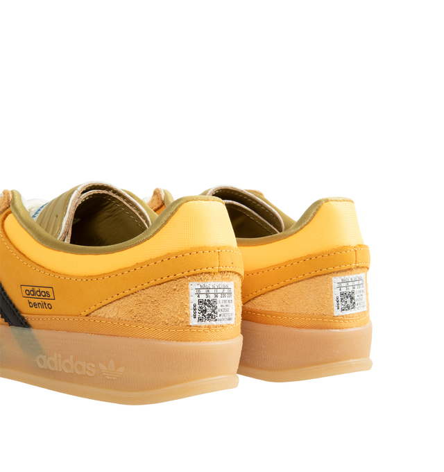 Image 3 of 5 - YELLOW - Adidas Originals x Bad Bunny Men's Gazelle Indoor Shoes feature the latest release from the ongoing adidas Originals by Bad Bunny collaboration, reimagining the iconic Gazelle Indoor silhouette through the artist's distinctive creative lens. Crafted with a premium leather upper, this statement sneaker combines heritage terrace style with contemporary design details, while a textile lining enhances comfort and a durable gum outsole provides everyday traction. Main Material: Leather Up