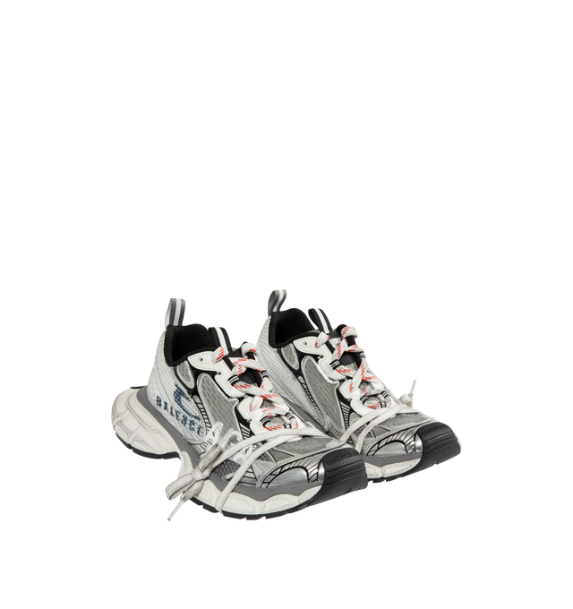 Image 2 of 5 - WHITE - BALENCIAGA 3XL Split Logo Sneaker featuring worn-out effect, split artwork printed on the exterior, Balenciaga logo at the edge of the toe and at back, printed size on the upper and at the back of the heel, 3XL branding printed on the tongue and back and tongue pull-on tab with reflective detail. Polyurethane, polyester. Sole: rubber, EVA. Insole: foam.