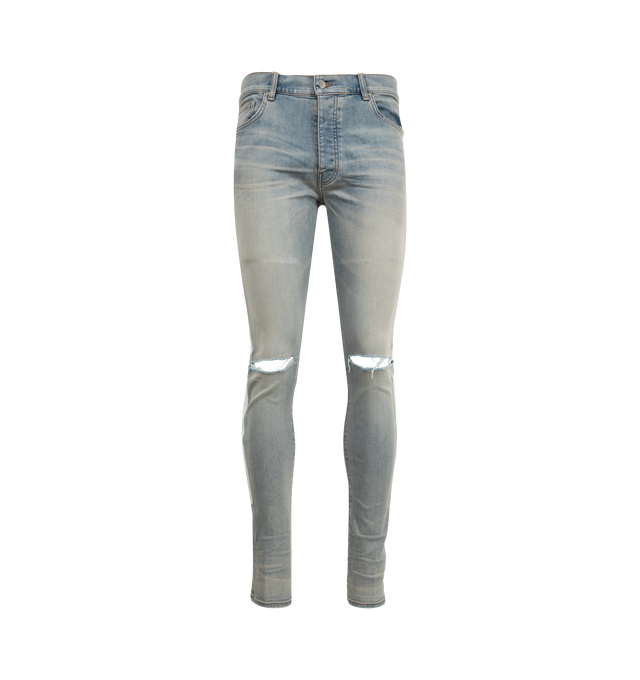 Image 1 of 4 - BLUE - AMIRI Bones Applique Distressed Jeans featuring white leather bones throughout side seams, distressed details throughout, tapered fit and ripped knees. 92% cotton, 6% elastomultiester, 2% elastane.