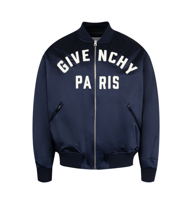 Image 1 of 3 - NAVY - GIVENCHY Paris Zipped Blouson in satin featuring bomber collar, GIVENCHY Paris gros grain patch with zigzag stitchings embroidered on the front, zipped closure, two zipped pockets, ribbed collar, hem and and cuffs and relaxed fit. 53% cotton, 47% acetate. Lining: 100% cotton.