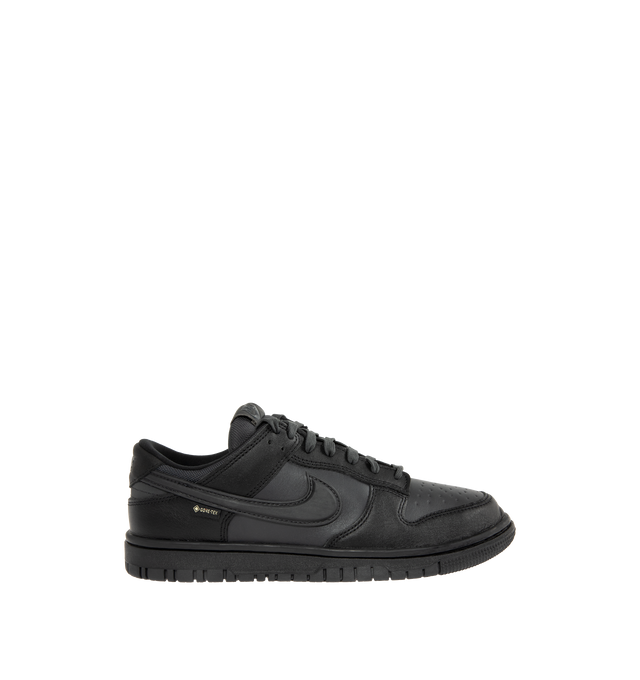 Image 1 of 5 - BLACK - NIKE Dunk Low GORE-TEX Sneaker featuring waterproof GORE-TEX, low-cut silhouette, reflective detail, padded collar, foam midsole and rubber outsole with classic pivot circle.