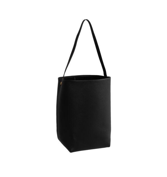 Image 2 of 3 - BLACK - THE ROW Classic tote bag in grained calfskin leather with interior tie closure, flat handle, and custom hook hardware. Measures 15 x 17 x 8 in. 100% Calfskin Leatherlined in suede. Made in Italy.