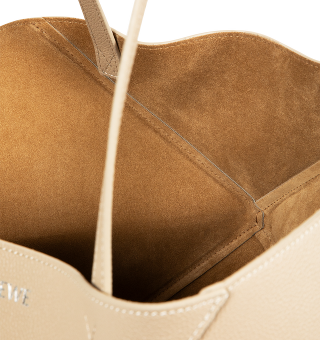 Image 3 of 3 - CHAMPAGNE - LOEWE Medium Horizontal Puzzle Fold Tote in soft grained calfskin featuring a lightweight geometric structure designed to fold completely flat, shoulder or hand carry, detachable inside zipped suede pocket, suede lining and gold embossed LOEWE. Soft grained calf. Strap drop: 27 cm. 29 cm x 31.5 cm x 12.5 cm. Made in Spain.