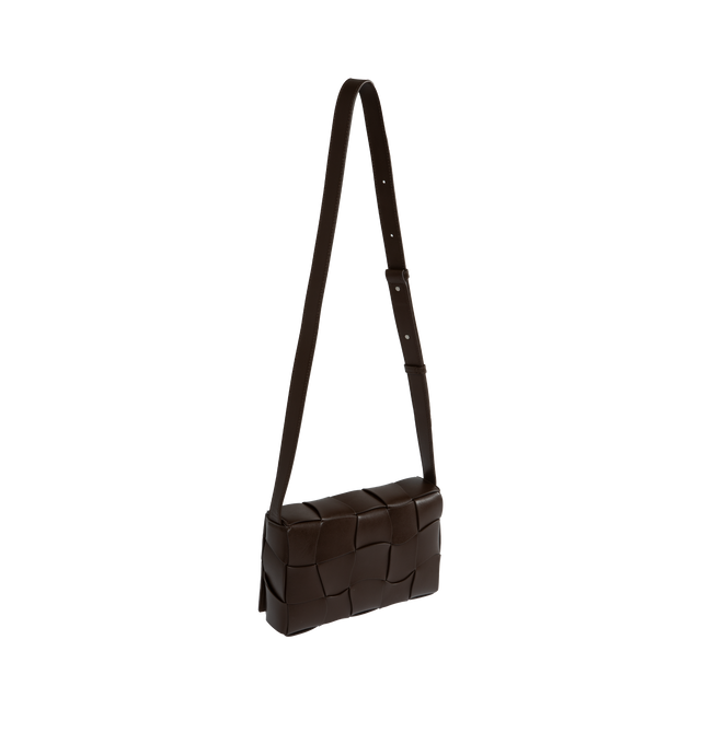 Image 2 of 3 - BROWN - BOTTEGA VENETA WAVED LEATHER CASSETTE CROSSBODY BAG with adjustable crossbody strap, magnetic fastening front flap closure, all-over intrecciato weave and one main compartment. 100% Leather. 