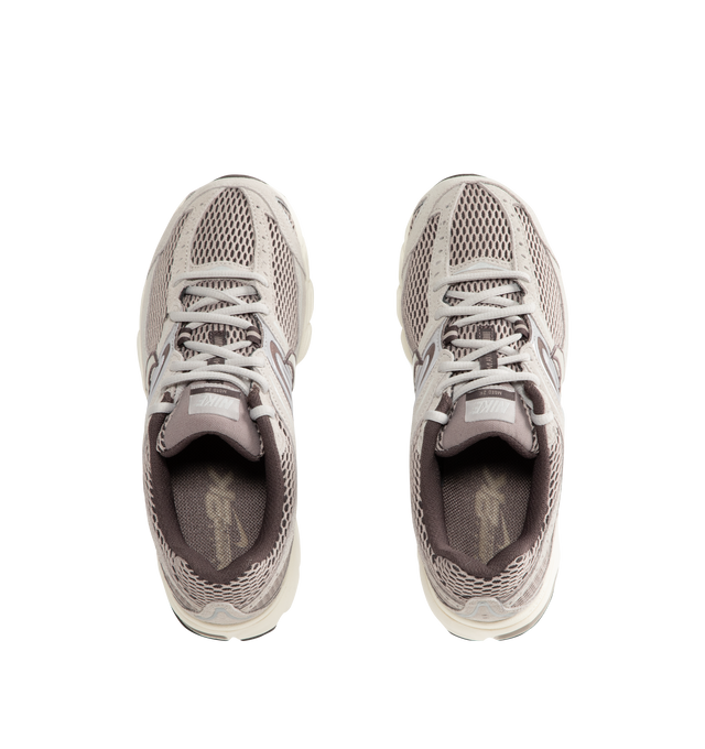 Image 5 of 5 - NEUTRAL - Nike Air Max Moto 2K Men's Sneakers feature a layered upper crafted from synthetic leather and textile with metallic accents for a modern, Y2K-inspired look. These performance-inspired lifestyle sneakers combine Max Air cushioning, a lightweight foam midsole, and a durable rubber outsole for all-day comfort and reliable traction. Main Material: Synthetic Leather and Textile. Midsole: Foam. Sole: Rubber.