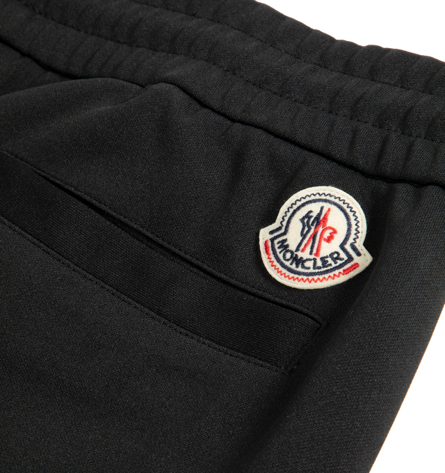 Image 2 of 2 - BLACK - MONCLER Sweatpants featuring elastic waist, side pockets, back welt pocket and logo patch. 100% polyester.