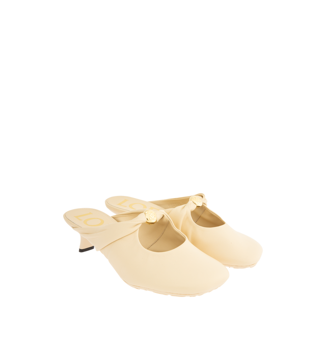 Image 2 of 4 - NEUTRAL - Loewe Women's Pebble Soft Mule in supple nappa lambskin with a flexible upper engineered for extra comfort, featuring a metallic pebble with an Anagram engraved detail, a signature petal toe shape, 45mm heel, engraved Anagram on Pebble, padded leather insole and Anagram embossed rubber outsole. Heel height: 4.5 cm. Nappa lambskin. Made in Italy.