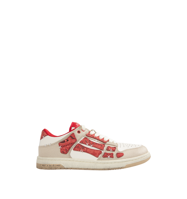 Image 1 of 5 - RED - AMIRI Bandana Skel Top Low Sneakers featuring low-top, buffed leather, logo pattern embossed throughout, perforated detailing at toe, lace-up closure, logo patch at padded tongue, padded collar, bandana print appliqus at sides and treaded rubber sole. Upper: leather. Sole: rubber.