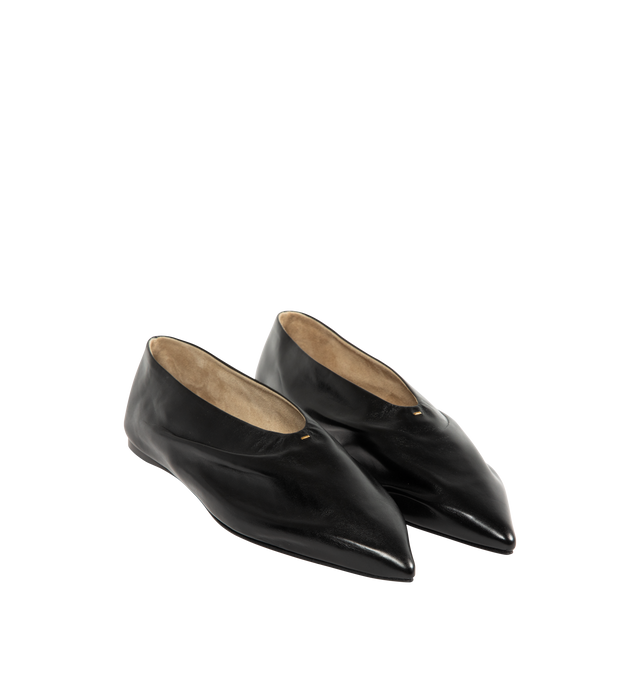 Image 2 of 4 - BLACK - Khaite Miriam ballerina flat inspired by the soft folds of fabric and crafted in Italy of glazed calfskin selected for its luminous shine. The deconstructed body is lined in cigar-hued suede, accentuating a natural fit that moves with the foot. Detailed with signature gold staple. Made in Italy. Glazed calf (100% calfskin).