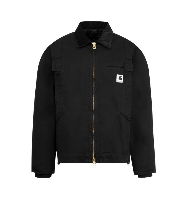 Image 1 of 3 - BLACK - SACAI X CARHARTT WIP Duck Cotton Jacket featuring spread collar, drop shoulders, long sleeves, rib-knit cuffs, chest and side welt pockets, asymmetric hem and front zip closure. 100% cotton. Made in Japan.