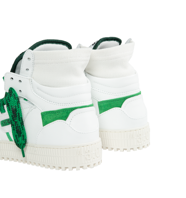 Image 3 of 5 - WHITE - OFF-WHITE 3.0 OFF COURT CALF LEATHER are high top "Off-Court" 3.0 sneakers in white with Off-White logo on one side. Green and black labels detailing. White rubber sole. Green and black lace-up closure. Outer: 30% Cotton Outer: 55% Leather Outer: 10% Polyamide Outer: 4% Polyester Sole: 100% Rubber Outer: 1% Elastane 