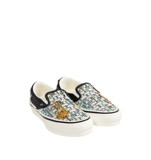 Image 2 of 5 - BLACK - Vans iconic slip-on shoe crafted from midweight canvas adorned with metal pins with rhinestones and crystal studding. Elevated design featuring higher sidewalls with gloss finish, enhanced cushioning and padded collar for support and all-day comfort. Elastic side panels for easy slip-on and off. Sola Foam ADC (All-Day Comfort) insole for soft and durable cushioning. Signature waffle outsole pattern for reliable grip.