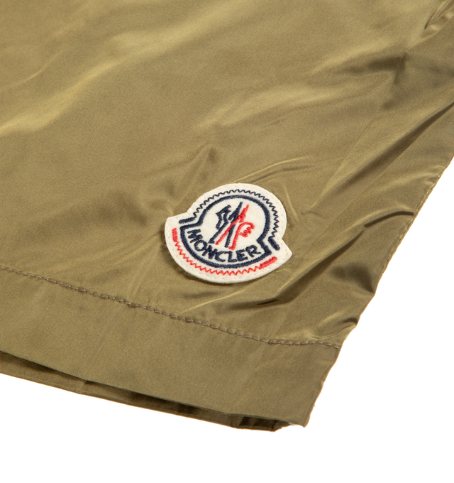 Image 2 of 3 - BROWN - MONCLER Logo Swim Shorts featuring micro mesh lining, adjustable waistband, snap button closure, side pockets, back pocket with snap button closure, stitching details and logo patch. 100% polyamide/nylon. Made in Albania.