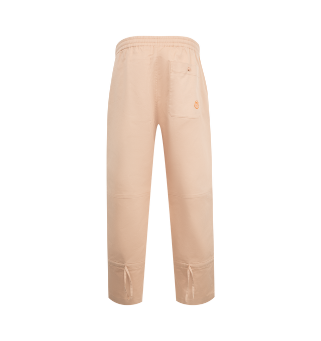 Image 2 of 3 - PINK - Moncler x Gilga Farm Designed by Donald Glover Cotton Gabardine Pants featuring longue saison lining, down-filled, zipper closure with ribbon trim, zipped pockets and logo patch. 74% cotton, 24% lyocell, 2% elastane/spandex. Made in Romania.