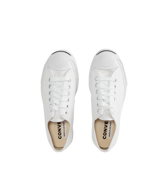 Image 5 of 5 - WHITE - Converse Jack Purcell Sneakers in a refined, sporty low top style. Featuring durable canvas upper, layers of comfort cushioning with a wedge helps provide optimal support, signature smile branding on the toe cap, and rubber sole with herringbone details helps provide traction. Unisex style in men's sizes.