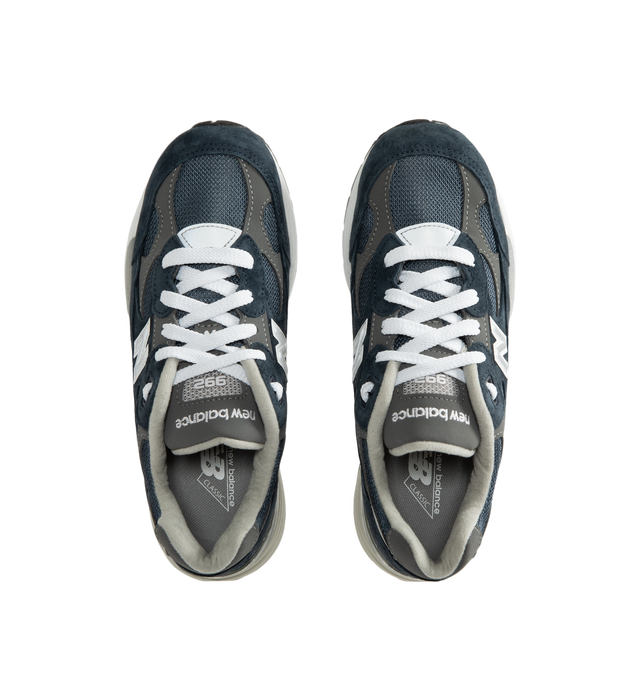 Image 5 of 5 - NAVY - New Balance Unisex Made in USA 992 Core Sneakers feature a mesh upper with premium suede overlays. ABZORB cushioning at the heel and forefoot absorbs impact, while a combined ENCAP and C-CAP midsole provides support. Reflective details and an Ndurance rubber outsole complete the design. Upper: Mesh and Suede. Sole: Rubber. Made in USA with 70% or more domestic value. *Unisex style in men's sizing.