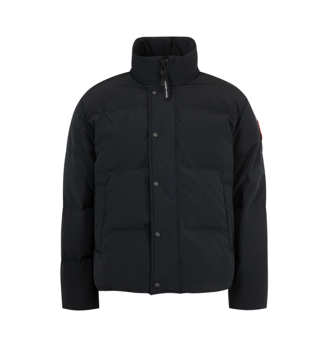 Image 1 of 4 - BLACK - CANADA GOOSE Bayview Parka Black Label featuring placket with snap buttons over two-way zipper, recessed rib-knit cuffs, brushed tricot-lined chin guard, hem with interior drawcord, interior backpack straps for hands-free carrying capabilities, two exterior fleece-lined pockets with snap closures, two interior mesh drop-in pockets and one zippered security pocket. 85% recycled polyester, 15% organic cotton.