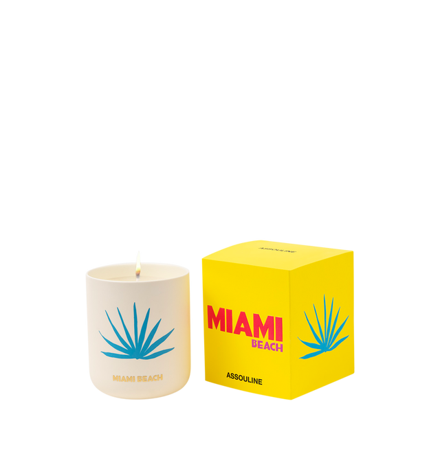 Image 1 of 5 - MULTI - Assouline Miami Beach - Travel From Home Candle. Its an everlasting summer with sun-drenched notes of bergamot, juicy peach, and smooth pistachio that capture the essence of sun-kissed beaches and lively summer beach parties. A heart of blooming florals intertwines with the balmy essence of sandalwood, creating a captivating aroma that embodies the spirited atmosphere and warmth of Miami's sultry nights. Material: Ceramic Vessel. Wax Family: Soy, Coco, Paraffin Blend. Approximate Bur