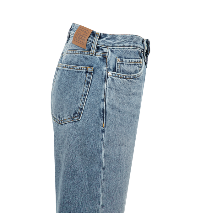 Image 2 of 2 - BLUE - TOTEME TWISTED SEAM DENIM FULL LENGTH featuring regular-fit pants, faded denim, two front pockets, belt loops and concealed zipper. 100% organic cotton. Made in Italy.