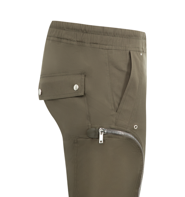 Image 3 of 3 - GREEN - RICK OWENS Bauhaus Cargo Pants featuring slim-fit, drawstring at elasticized waistband, four-pocket styling, exposed zip fly, rivets, eyelets, and press-stud hardware at front, zip vent at elasticized cuffs and zip pocket at outseams. 97% organic cotton, 3% elastane.