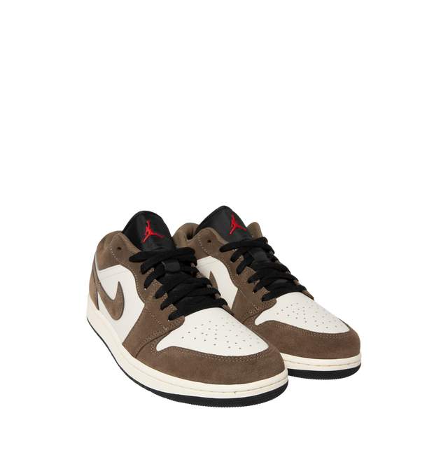 Image 2 of 5 - BROWN - Air Jordan 1 Low Sneakers feature a genuine leather & suede upper with the iconic low-top silhouette for a clean, timeless heritage look. These lifestyle sneakers combine encapsulated Air-Sole cushioning with a durable rubber outsole for lightweight comfort, lasting support, and reliable everyday traction. Main Material: Genuine Leather. Midsole: Encapsulated Air-Sole Unit. Sole: Rubber.