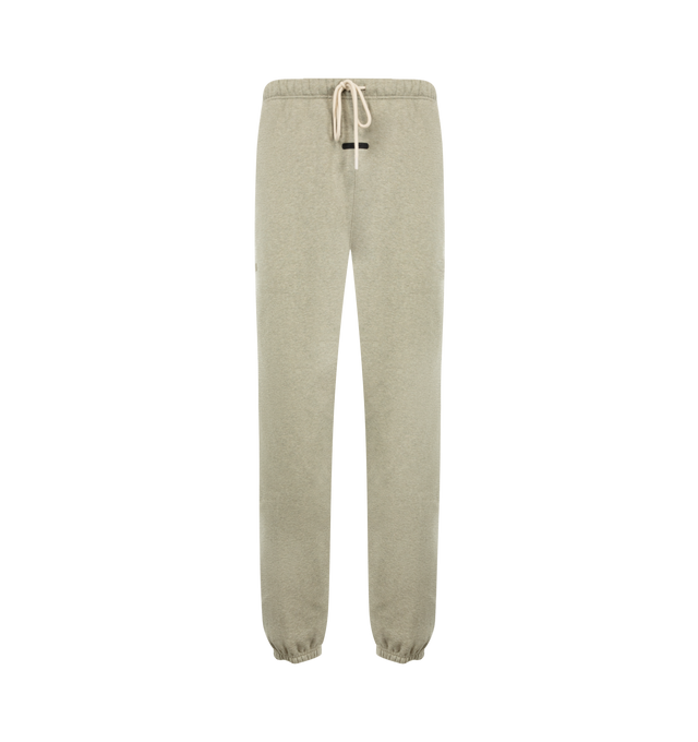 Image 1 of 3 - NEUTRAL - Fear of God Essentials Mens Classic Sweatpants are crafted from heavyweight 380 GSM cotton-blend core fleece. Feature a classic relaxed fit with tapered legs, elasticized waistband with bungee drawcord, side-seam pockets, elastic ankle cuffs, puff-printed Fear of God and Essentials branding, and an Essentials logo label. Main Material: 80% Cotton, 20% Polyester.