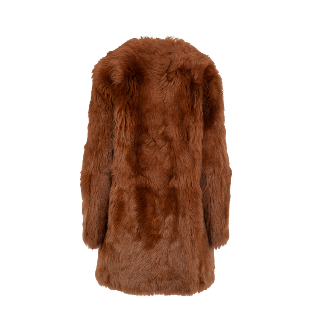 Image 2 of 3 - ORANGE - Toteme Women's Short Silky Shearling Coat Ginger is a statement coat made from soft lamb shearling with long silky hairs for a dramatic take on texture. It has a round neckline, side-seam pockets, and concealed hooks for a clean finish. Main Materials: Lamb shealing/leather, Suede interior.