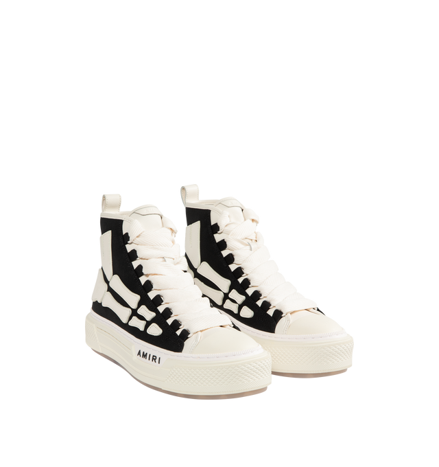 Image 2 of 5 - BLACK - AMIRI Skel Court Hi Sneakers featuring high-top cotton canvas and buffed leather sneakers, rubber cap toe, lace-up closure, logo embossed at tongue, pull-loop at heel collar, graphic appliqus at sides, logo embossed at outer midsole and treaded rubber sole. Upper: textile, leather. Sole: rubber.