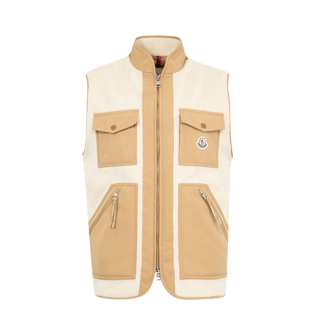 Image 1 of 3 - NEUTRAL - MONCLER Karakai Teddy Down Vest featuring teddy fleece, micro polyester back and lining, micro soft trim and pockets, down-filled, zipper closure, zipped kangaroo pockets and patch pockets with snap button closure. 100% polyester. 73% polyester, 27% acrylic. Lining: 100% polyester. Padding: 90% down, 10% feather.