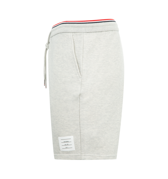 Image 3 of 3 - GREY - THOM BROWNE Pique Loopback Sweat Shorts featuring french terry shorts, drawstring at striped rib-knit waistband, three-pocket styling and logo patch at front cuff. 100% cotton. Made in Japan.
